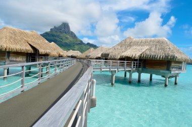 Luxury overwater vacation resort on Bora Bora clipart