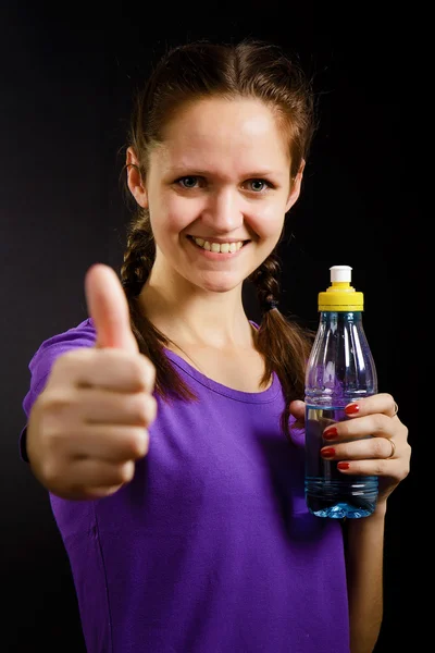 Nő egy üveg vízzel — Stock Fotó