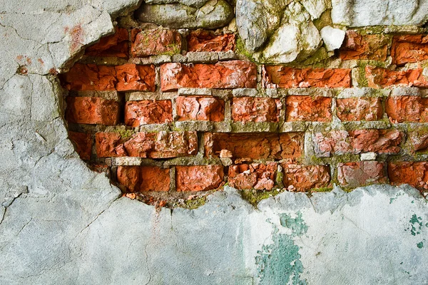 The destruction of a brick wall — Stock Photo, Image