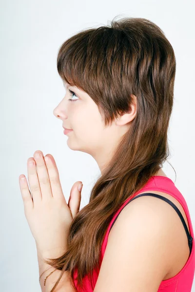 Menina de olhos azuis adolescente rezando. perfil — Fotografia de Stock