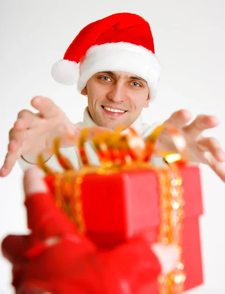 Young man in a Santa hat — Stock Photo, Image