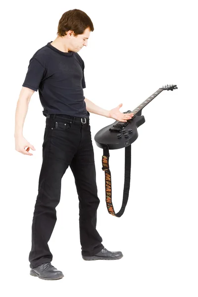 Virtuoso guitarist, dressed in black — Stock Photo, Image