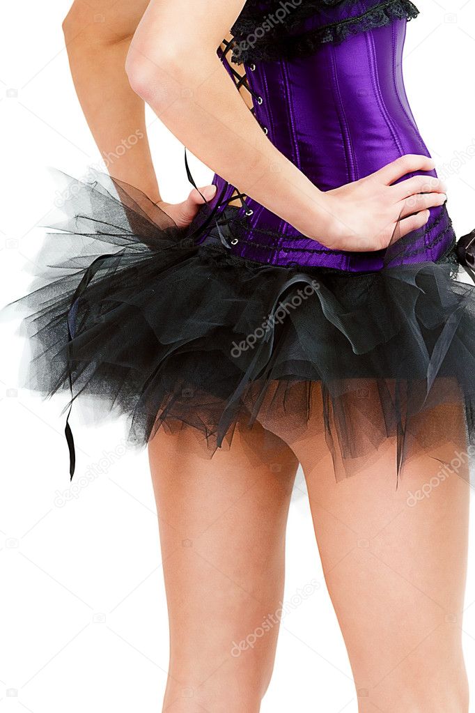sexy young girl in a skirt and corset. View from the back
