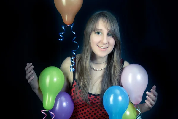 Sorridente ragazza con palloncini colorati — Foto Stock