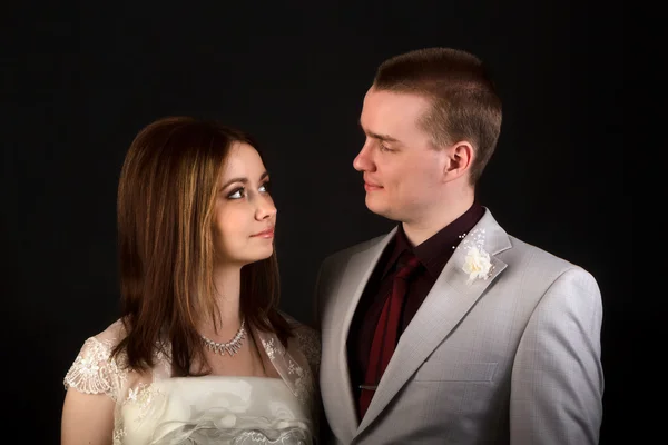 Bride and groom on a black background — Stock Photo, Image