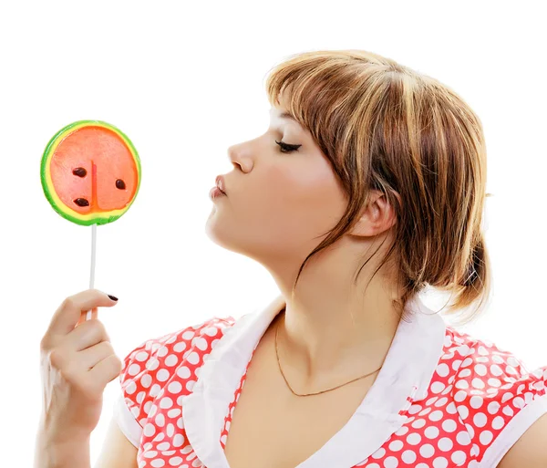 Attractive girl with a round lollipop — Stock Photo, Image