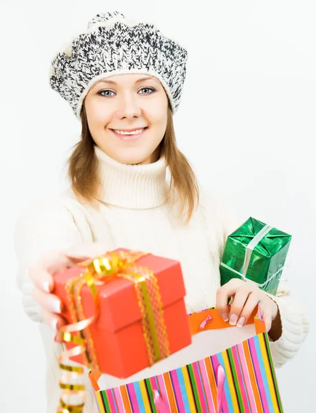Charming smiling girl holding a gift box — Stock Photo, Image