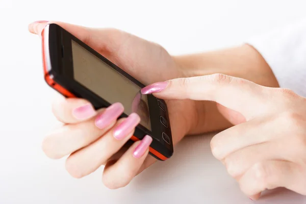 Mobile phone in women hand — Stock Photo, Image