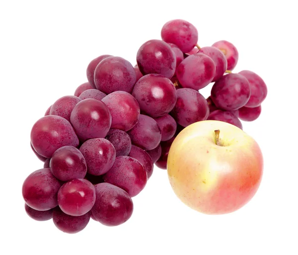Massa röda druvor och apple isolerade — Stockfoto