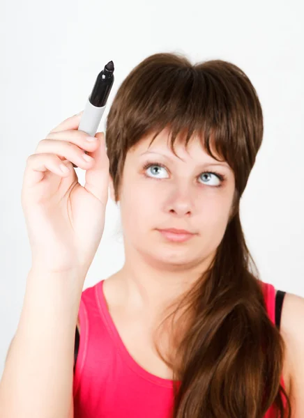 Young girl writing with a black marker — Stock Photo, Image