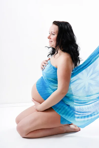 Une jeune femme enceinte — Photo