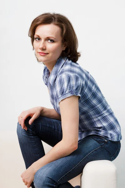 Girl in a plaid shirt and jeans — Stock Photo, Image