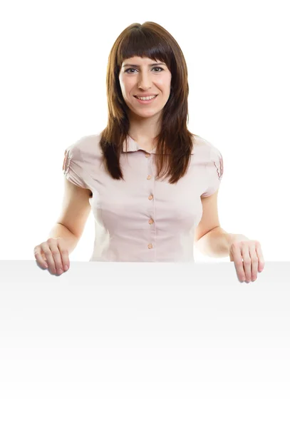 Attraktive junge Frau mit einem Poster auf einem isolierten weißen — Stockfoto