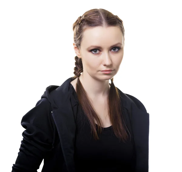 Portrait of a serious young woman on a white background — Stock Photo, Image