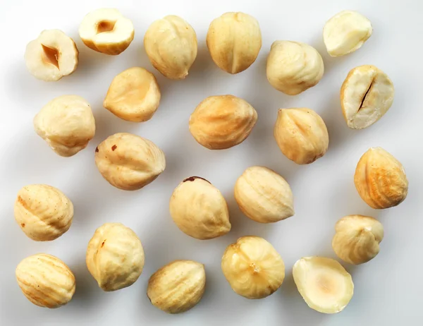 Closeup view of hazelnuts over white background — Stock Photo, Image