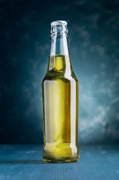 alcoholic beverage bottle on blue background