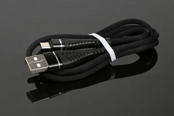 Black Usb Cable Charging Smartphone Black Acrylic Background High Resolution — Stockfoto