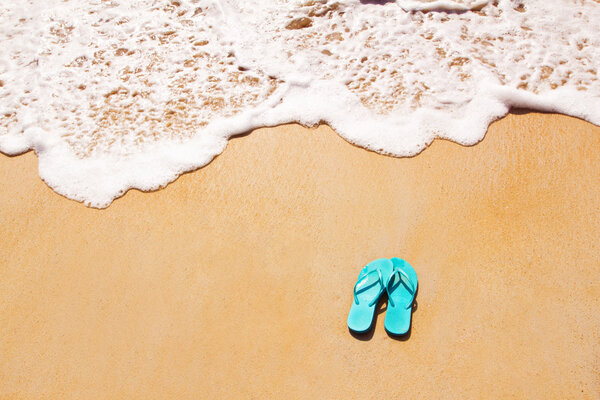 Flip flops on the sand