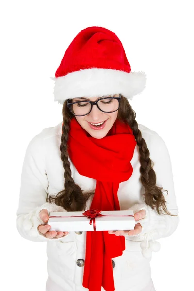 Beautiful woman in a Christmas hat holding a gift — Stock Photo, Image