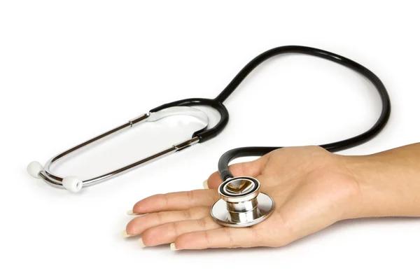 Stethoscope in a hand — Stock Photo, Image