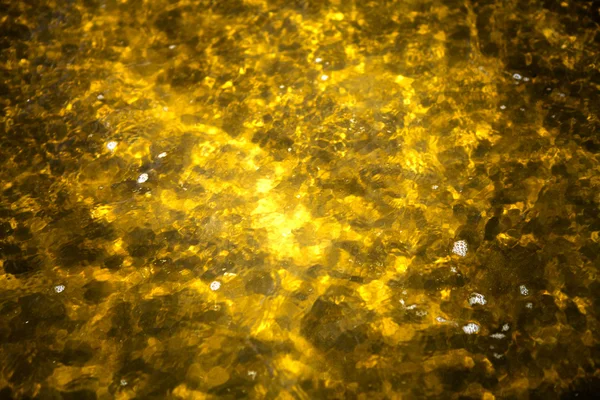 Yellow water background — Stock Photo, Image