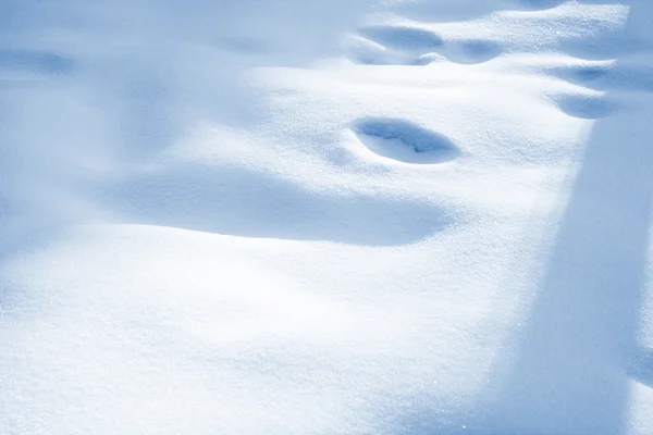 Schneeflocke im weißen Schnee — Stockfoto