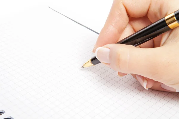 Pen in hand Isolated on white background Stock Photo