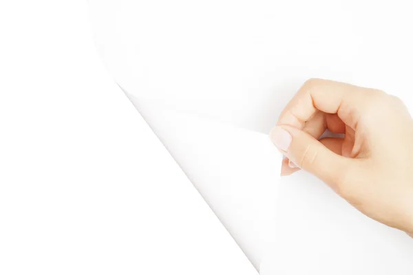 Een menselijke hand open witte pagina van papier — Stockfoto