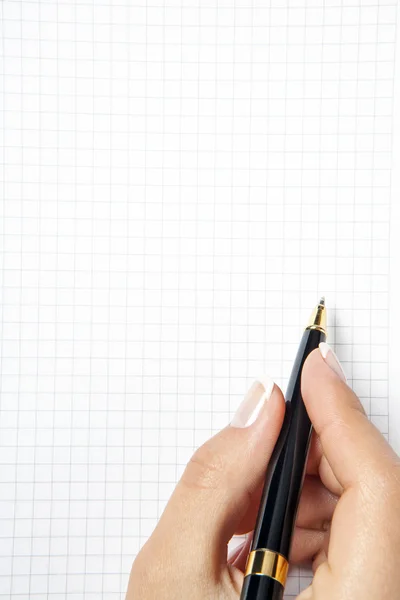 Penna i handen isolerad på vit bakgrund Stockfoto