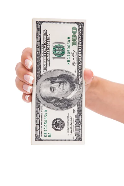 Доллары в руке женщины — стоковое фото