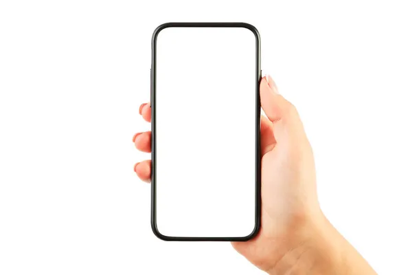 Mano de mujer sosteniendo el teléfono inteligente negro con pantalla en blanco aislado sobre fondo blanco —  Fotos de Stock