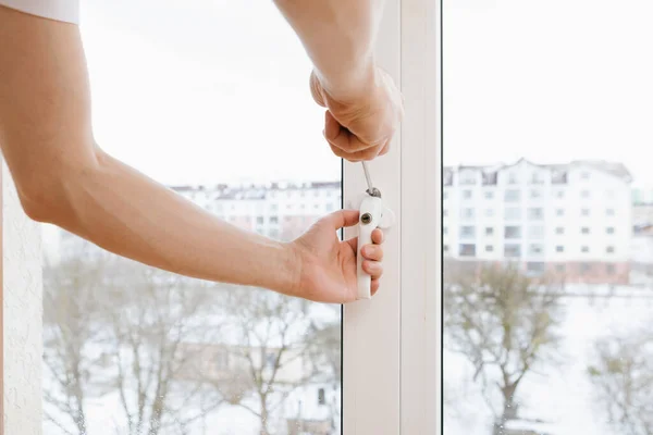 The worker installing and checking window in the house — Stock Photo, Image