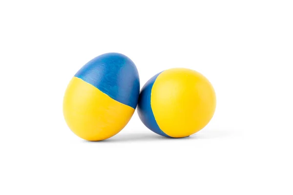 Easter egg blue and yellow on Ukraine flag colors as concept for war Ukraine — ストック写真