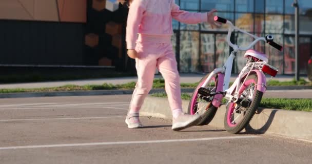 Little girl on a bicycle in summer park. cycling outdoors — Stock Video