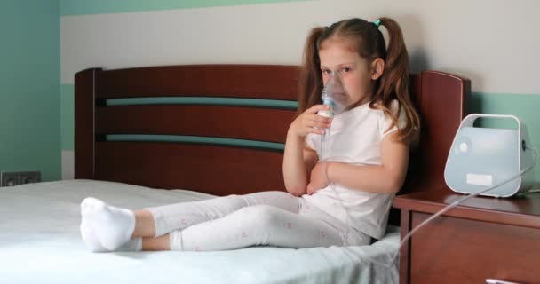 Girl making inhalation with nebulizer at home. — Stock video