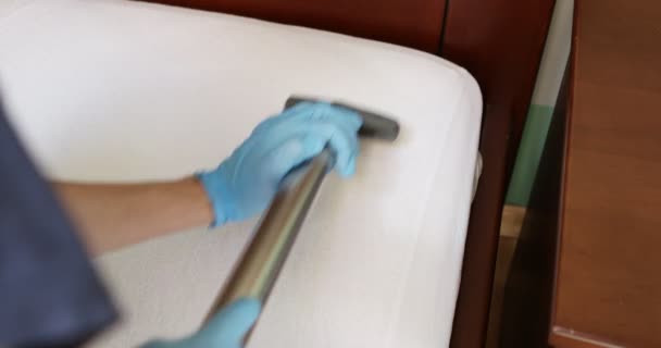 Janitor cleaning mattress with professional equipment in bedroom, closeup — Stock Video