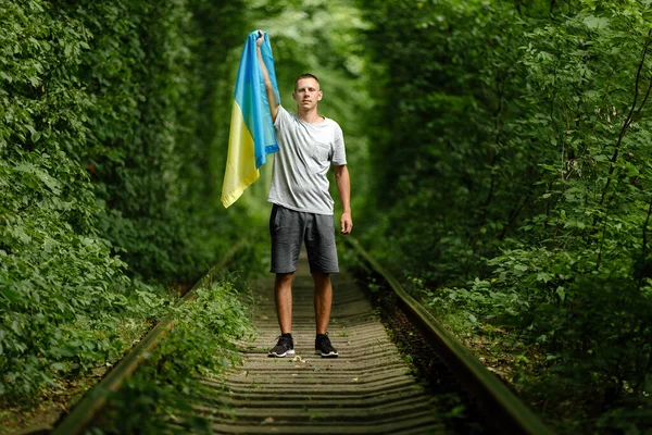 Man Raised His Hands Holds Ukrainian Flag His Back Concept —  Fotos de Stock