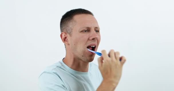 Man Squeezes Toothpaste Brush Brushes His Teeth High Quality Footage — Stock video