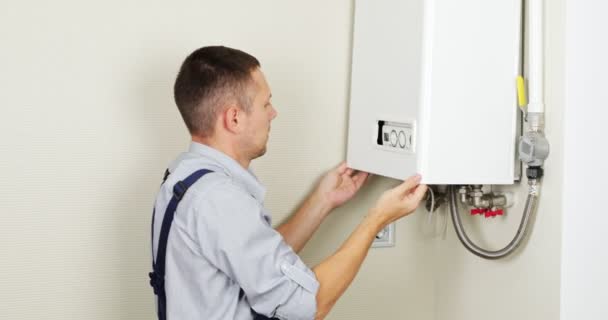 Plumber Attempting Fix Residential Heating Problem Gas Boiler Repair — Wideo stockowe