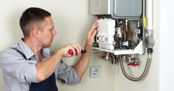 Plumber Attempting Fix Residential Heating Problem Gas Boiler Repair — Stockvideo