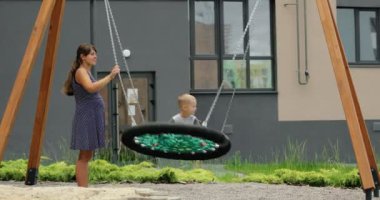 child spends time with families on the playground. High quality 4k footage