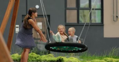 child spends time with families on the playground. High quality 4k footage
