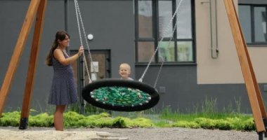 child spends time with families on the playground. High quality 4k footage