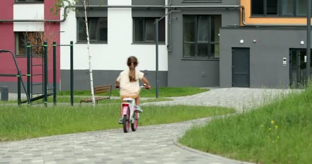 Little Girl Riding Bike Playground High Quality Footage — Stockvideo