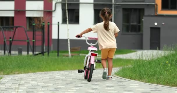 Little Girl Riding Bike Playground High Quality Footage — Stockvideo