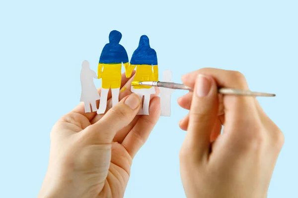 Woman Hands Hold Paper Cut Family Painted National Colors Ukraine — Zdjęcie stockowe