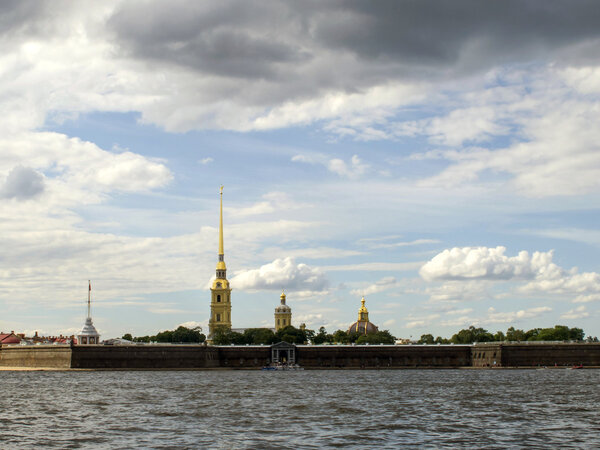 Russia, St. Petersburg. View Peter and Paul Cathedral on the background of cloudy sky