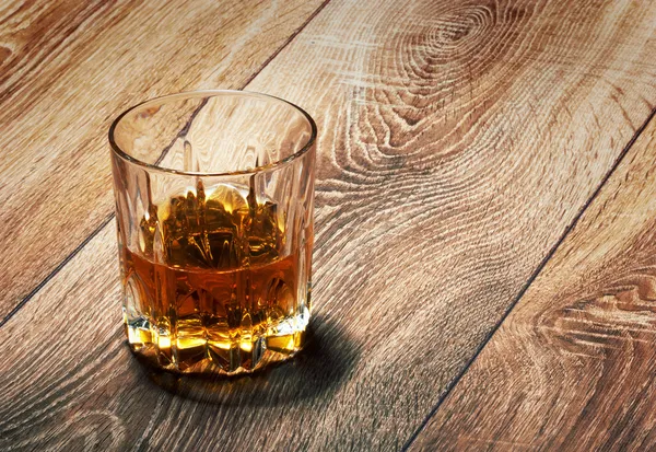 Whiskey in glasses on wooden — Stock Photo, Image