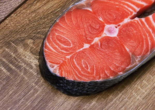 Piece of a salmon on a wood — Stock Photo, Image