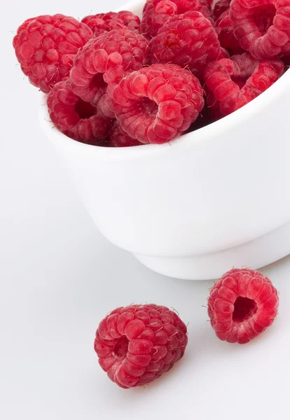 Freshly picked ripe red raspberries, isolated on white — Stock Photo, Image